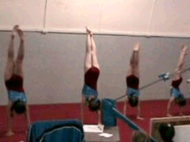 Empire students practice their handstands